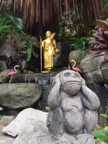 Buddha and closing ear monkey at Wat Saket